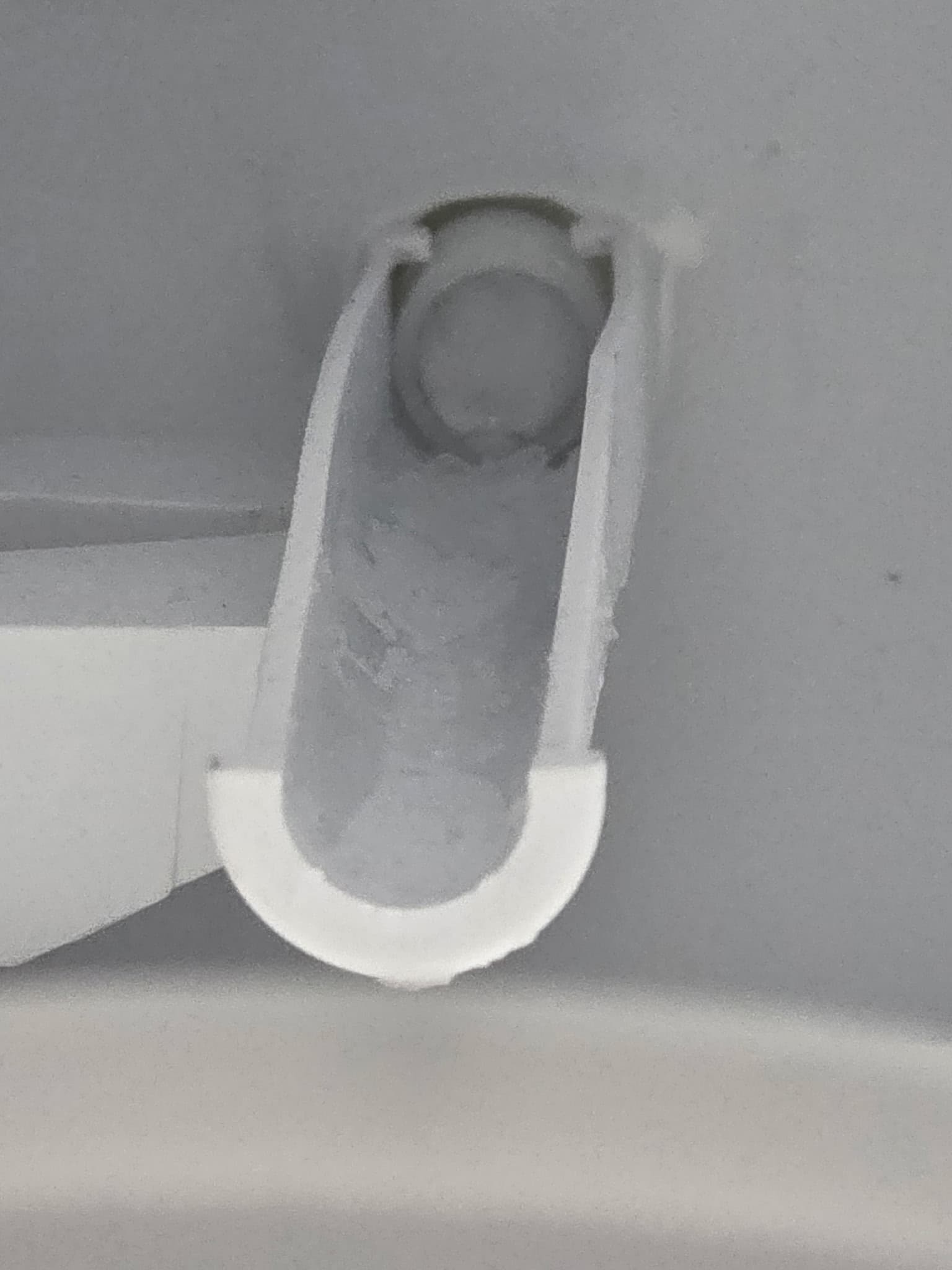 Water intake tube with mineral buildup and calcium deposits before cleaning